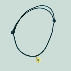 Marie-Helene de Taillac 22k gold clover charm with Peridot center. 🍀